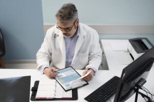 medium-shot-doctor-filling-document-high-angle